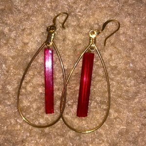 Gold earrings with red jewel